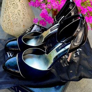 Black and silver , 3.5 inch ankle strap heels. Never worn!!